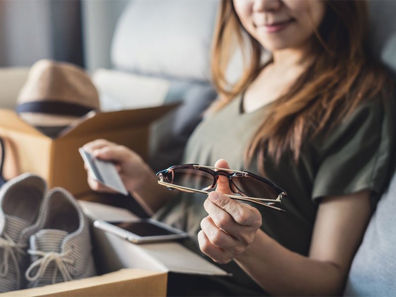 A girl checking the things that ordered via online shopping