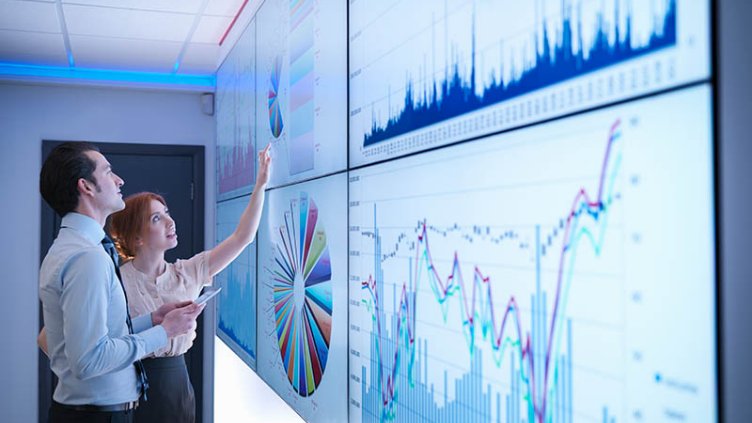 Men and women discussing about various data
