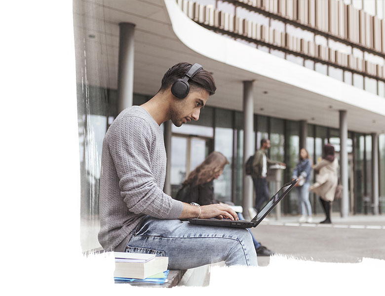 student looking into his laptop