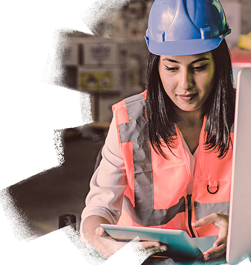 Female Safety Inspector With Digital Tablet At Construction Site