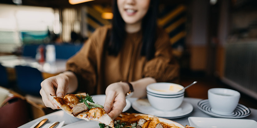 Women eating Pizza