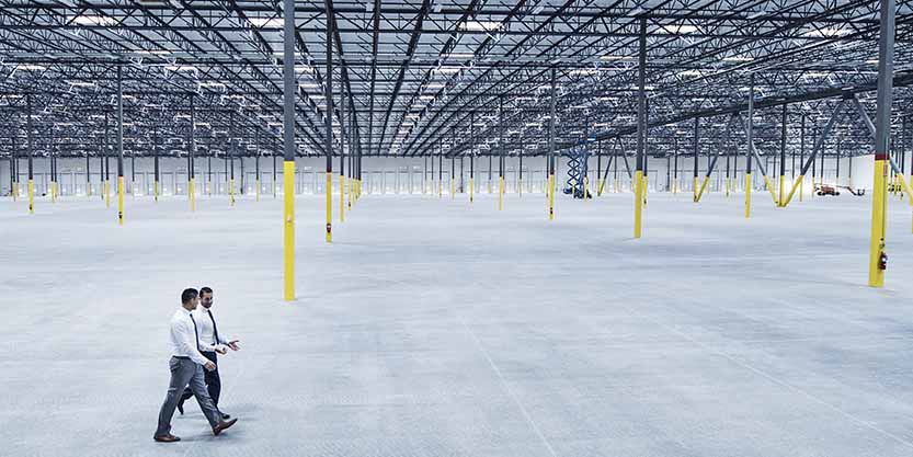 Men walking inside the warehouse