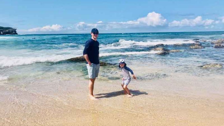 Father and his children having fun at the beach