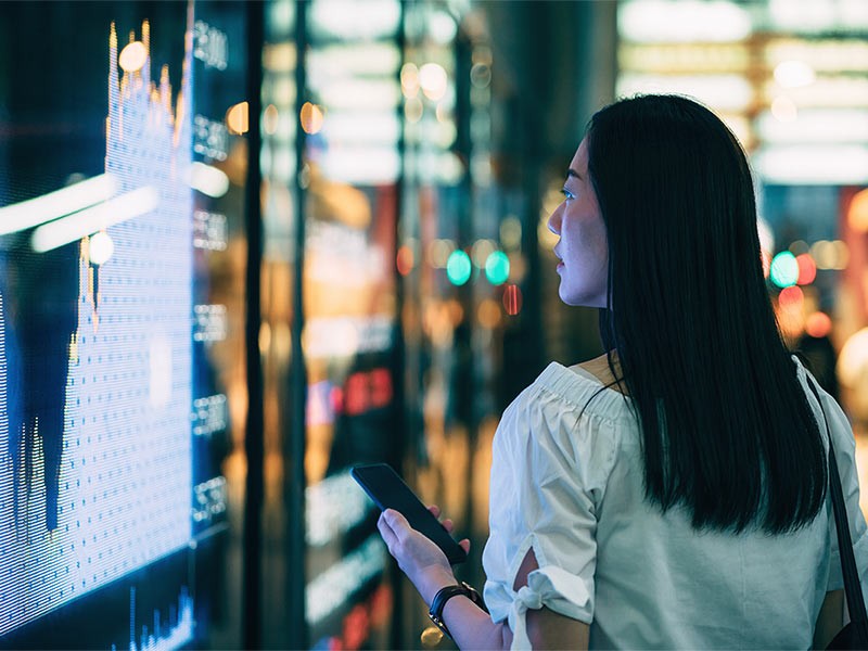 A female looking into reits breaking stock list