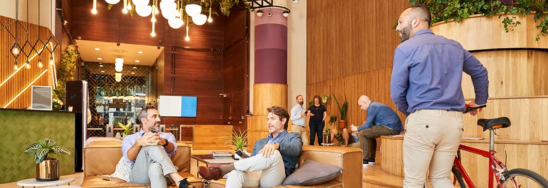 Welcoming workplace lobby with people sitting and talking