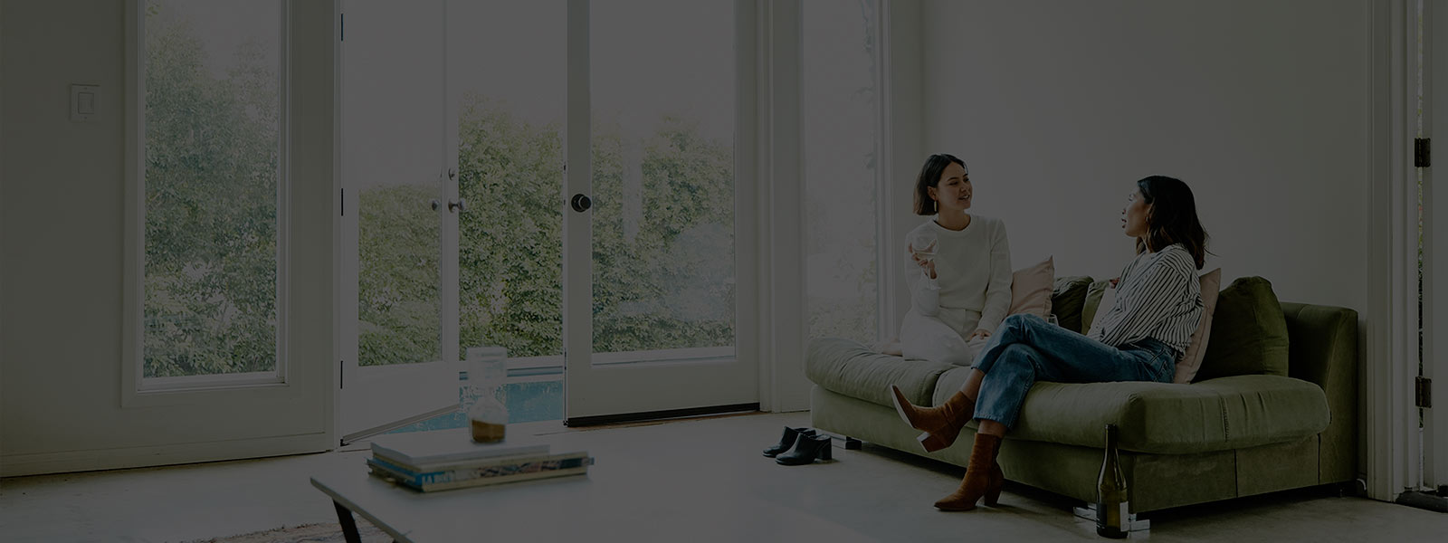 Two women having a chat in living room