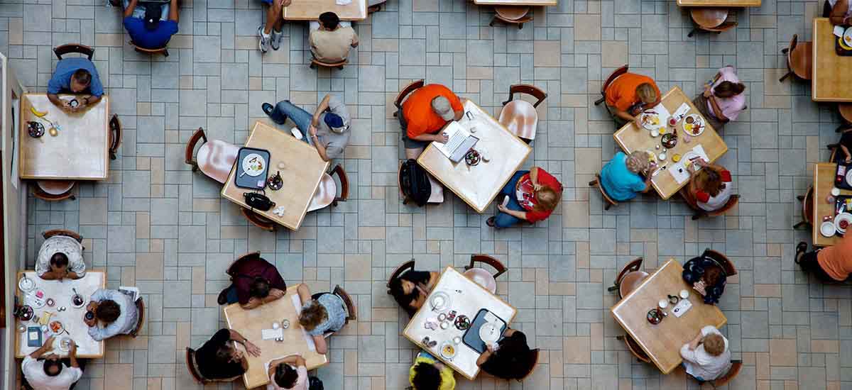 Diverse people sitting in a food hall